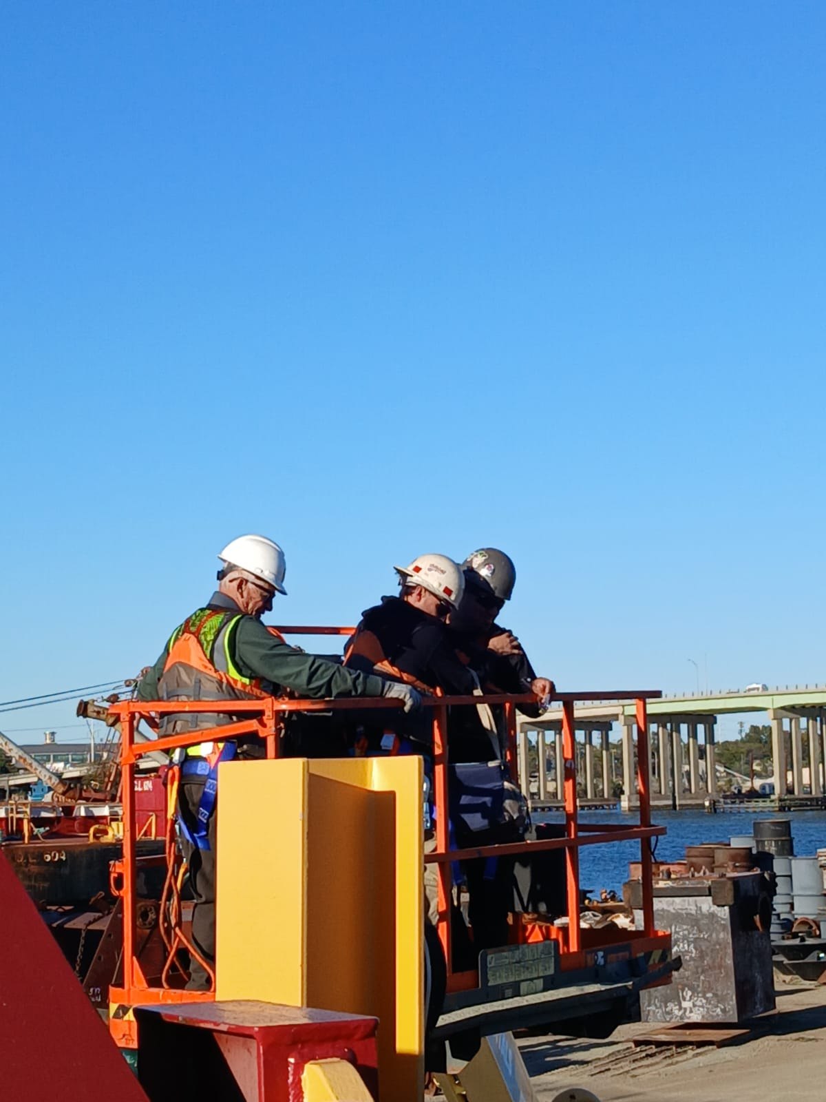 EA crew coordinating structural work from an elevated platform